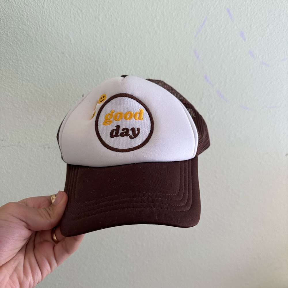 Black and white hat with smiley face